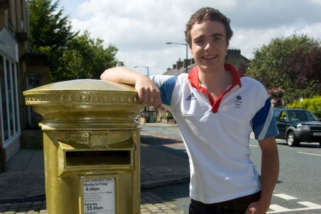 Steven Burke with his special gold letterbox in honour of his gold medal at the London Olympics.