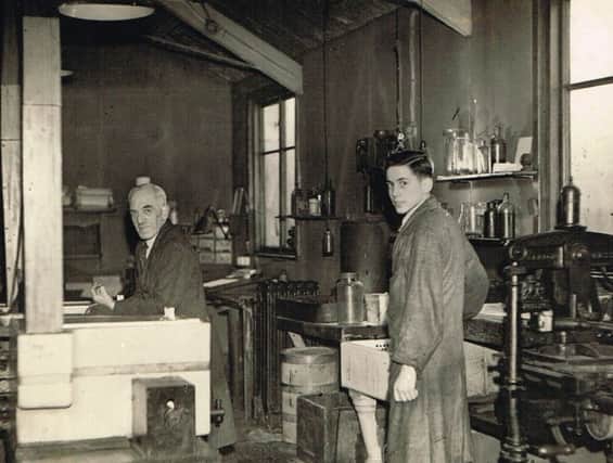 A young Eddy Rawlinson with Fred Simcock in the Burnley Express engraving room. (s)