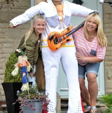 Picture by Julian Brown 27/08/16

Mum and daughter, Chloe (11) and Rachael Aspden with Elvis

Higham Scarecrow Festival