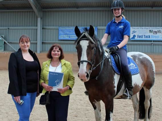 (From left) Julie Rickwood-Gan, HAPPA Development Officer, Julie Cooper MP, and Paige Ashton, HAPPA Equine Care Rider (riding HAPPA's Trixie)