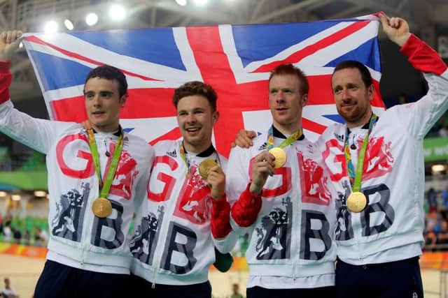 Great Britain's (left-right) Steven Burke, Owain Doull, Ed Clancy and Sir Bradley Wiggins with their gold medals following victory in the men's team pursuit final on the seventh day of the Rio Olympics Games, Brazil. PRESS ASSOCIATION Photo. Picture date: Friday August 12, 2016. Photo credit should read: David Davies/PA Wire. EDITORIAL USE ONLY