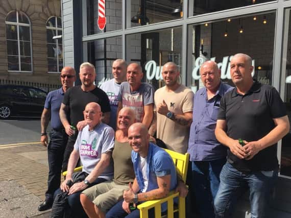 The Burnley Baldies after their Brave the Shave challenge with barber Neil Crossley (second from left)