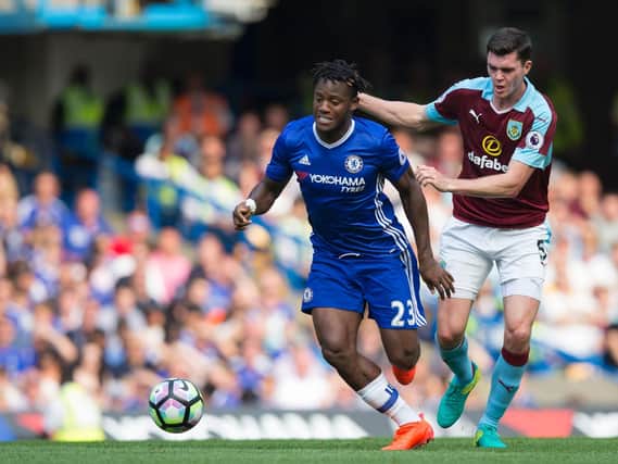 Michael Keane challenges Chelsea's Michy Batshuayi