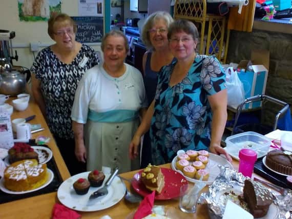 The cakes are served up at the Macillan World's Biggest Coffee Morning at Nelson Baptist Church by (from left to right) Eileen Cumpsty, Susan Hacking (organiser) Glenis Gorton and Linda Hill (s)