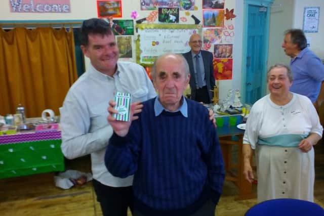 Alan Duerden (91) with his Star Baker award from the Rev Richard Booth and Susan Hacking at Nelson Baptist Church