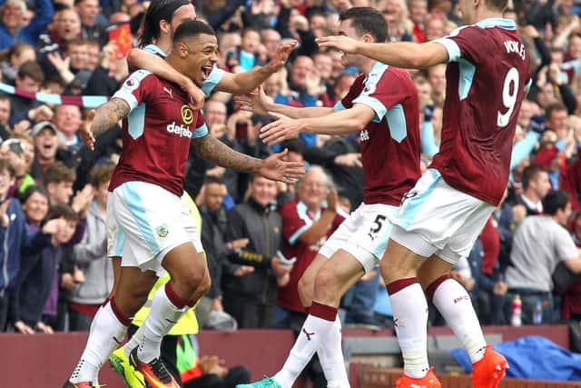 Andre Gray celebrates his goal against Liverpool