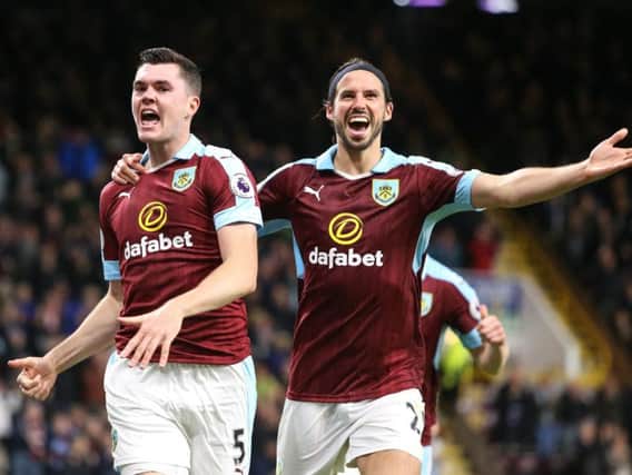 Michael Keane celebrates doubling the Burnley lead with George Boyd