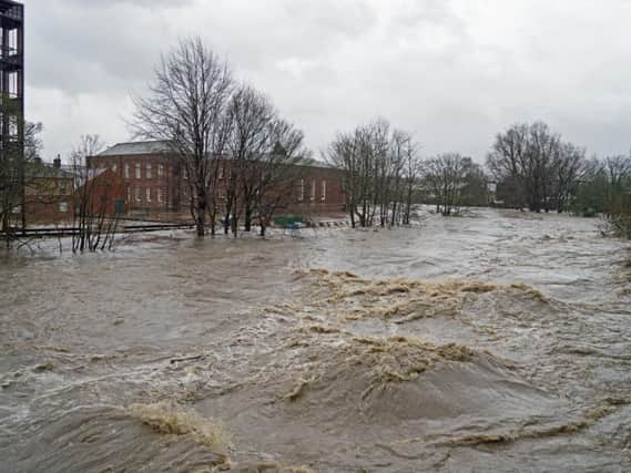 The River Calder bursts its banks during the height of the Boxing Day floods in Padiham