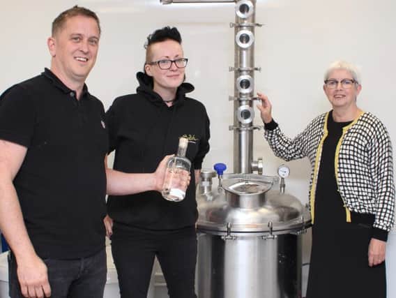 Batch Brew director Phil Whitwell, head distiller Emma and Burnley Council Executive member Sue Graham (s)