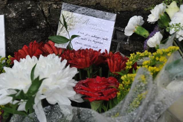 Floral tributes at the scene of the crash