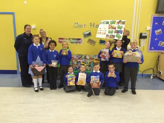 Pupils from Padiham Primary School with their food donations to the food bank.