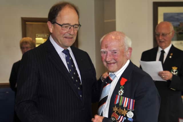 Denis Macro receives his Legion d'Honneur from Jeremy Burton, Honorary French Consul