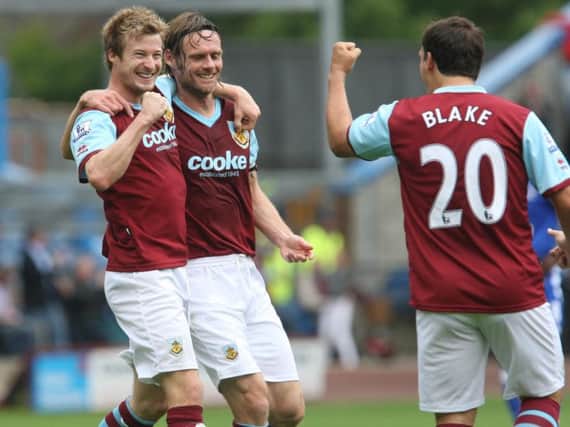 Wade Elliott, Graham Alexander and Robbie Blake celebrate the 1-0 victory over Everton in 2009