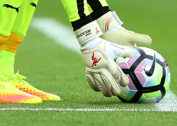 Win a pair of signed Tom Heaton gloves