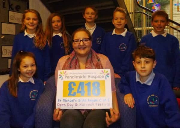 Hospice fund-raiser Sammi Graham with pupils from St Michael and All Angels (s)