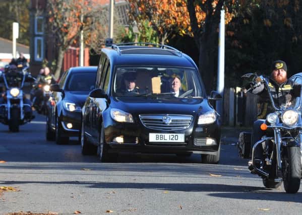 A solo motorcyclist leads the hurse as hundreds of motorcyclists form a motorcade to the funeral of Gary Kirton, from Shevington to Ince Crematorium