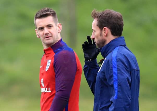 England's caretaker manager Gareth Southgate (right) with Tom Heaton during a training session at St George's Park, Burton. PRESS ASSOCIATION Photo. Picture date: Tuesday November 8, 2016. See PA story SOCCER England. Photo credit should read: Mike Egerton/PA Wire. RESTRICTIONS: Use subject to FA restrictions. Editorial use only. Commercial use only with prior written consent of the FA. No editing except cropping.