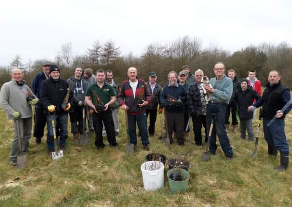 Volunteers help the Alkincoats Park Nature Reserve group plant saplings as part of its extension (s)