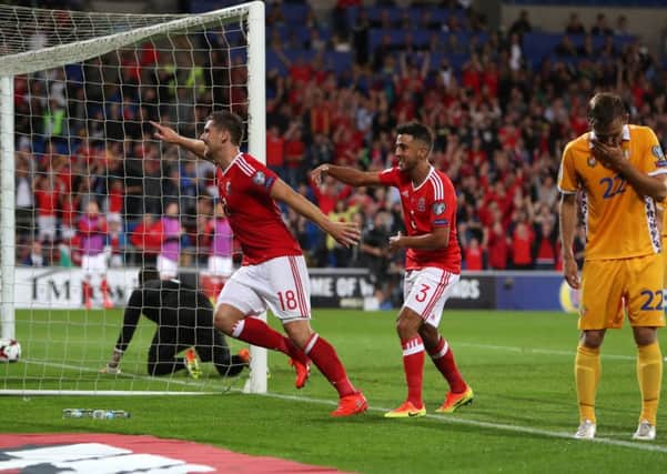 Wale's Sam Vokes celebrates scoring his side's first goal of the game during the 2018 FIFA World Cup Qualifying, Group D match at the Cardiff City Stadium. PRESS ASSOCIATION Photo. Picture date: Monday September 5, 2016. See PA story SOCCER Wales. Photo credit should read: David Davies/PA Wire. RESTRICTIONS: Editorial use only, No commercial use without prior permission, please contact PA Images for further information: Tel: +44 (0) 115 8447447.