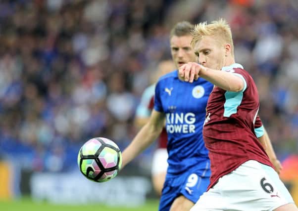 Ben Mee clears under pressure from Leicester City and England striker Jamie Vardy