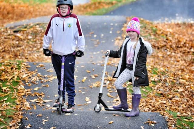 Picture by Julian Brown 03/11/16

Jake Thurlow (10) and Ellie Haworth (8) enjoy the new Skate Track in Padiham near the Leisure Centre