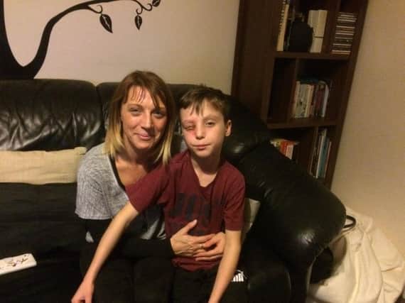 Tyler recovers at home with his mum Nicola