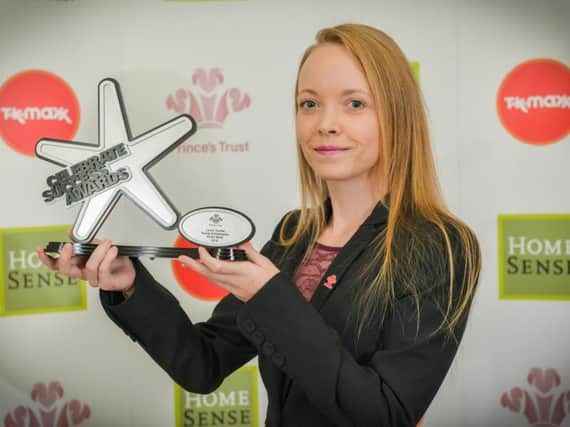 Young Ambassador of the Year Laura Tombs with her award