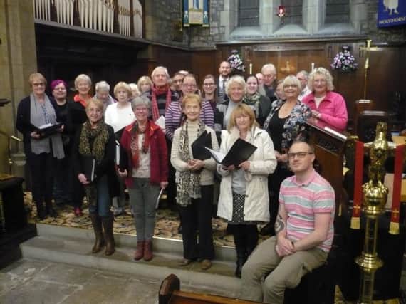 Choir members in rehearsals for their Christmas concert at St John's Church in Worsthorne.