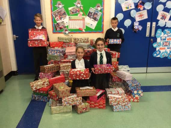 Students from St James Primary School in Lanehead, Burnley, with their boxes of gifts for Operation Christmas Child.