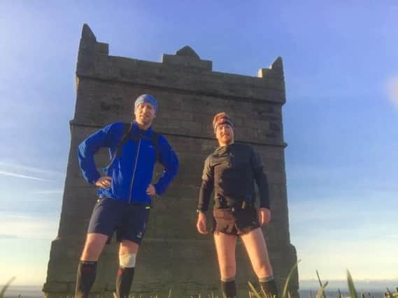 Phill Walmsley (right) will cover an astonishing 2,300 miles across the nine events he is running for charity.