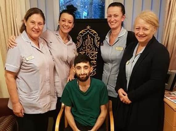 Shahbaz with staff at Pendleside Hospice