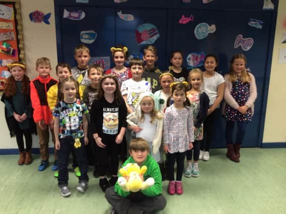 Pupils at St James' Lanehead CE Primary School dressed in non-uniform for charity. (s)
