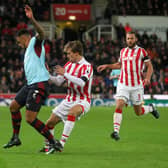 Andre Gray is fouled by Marc Muniesa