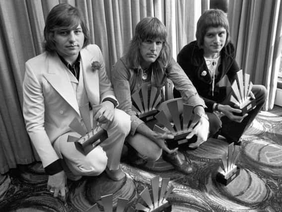Greg Lake, Keith Emerson and Carl Palmer at Kennington Oval with their awards gained in the Melody Maker Polls