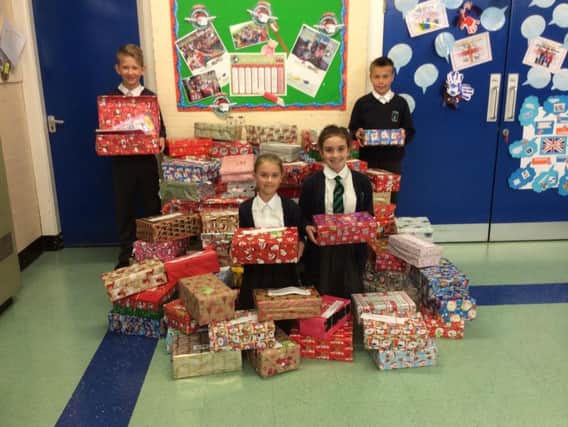 Pupils at St James Lanehead CE Primary School have collected shoeboxes filled with presents for children in need. (s)