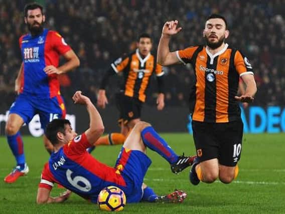 Robert Snodgrass of Hull City wins a penalty against Crystal Palace, despite no contact from Scott Dann