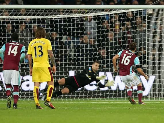 Tom Heaton saved Mark Noble's penalty but couldn't stop the follow up