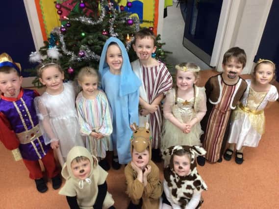 Children from Simonstone Primary School prepare to stage their version of It's A Baby as part of the Christmas festivities.