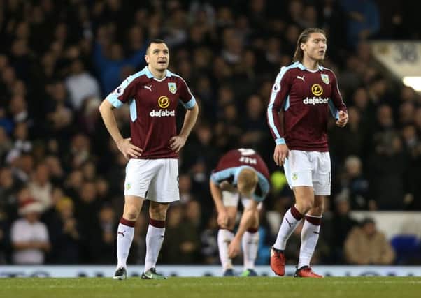 Dean Marney, left, and Jeff Hendrick react to Spurs winning goal on Sunday