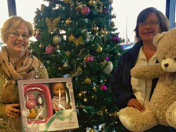 Salvation Army captain Maisie Veacock (right) with Burnley Express reporter Sue Plunkett and some of the gifts for the Christmas Toy Appeal.