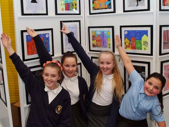 Year six students Jaida Simpson, Mia Haworth, Charlotte Booth and KT Cook show off their artwork at Rosewood Primary School.
