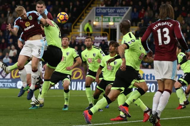 Burnley's Ben Mee beats Bournemouth's Simon Francis to the ballPhotographer Stephen White/CameraSportThe Premier League - Burnley v Bournemouth - Saturday 10th December 2016 - Turf Moor - Burnley World Copyright Â© 2016 CameraSport. All rights reserved. 43 Linden Ave. Countesthorpe. Leicester. England. LE8 5PG - Tel: +44 (0) 116 277 4147 - admin@camerasport.com - www.camerasport.com