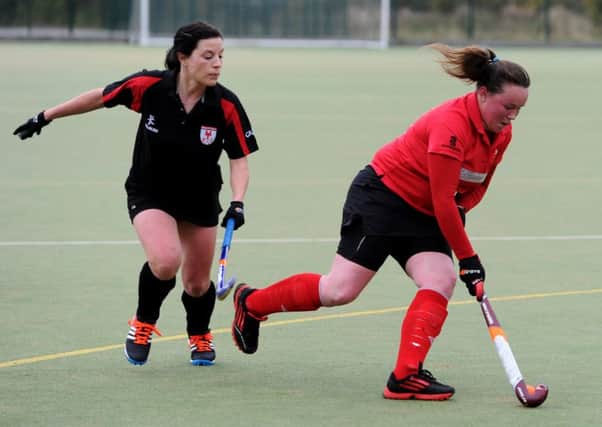 Pendle Forest 2nd (red) v Leyland and Chorley 1st (black), Ladies Hockey at Marsden Heights College, Nelson. Hayley Baines in action for Pendle Forest. Picture by Paul Heyes, Saturday October 31, 2015.