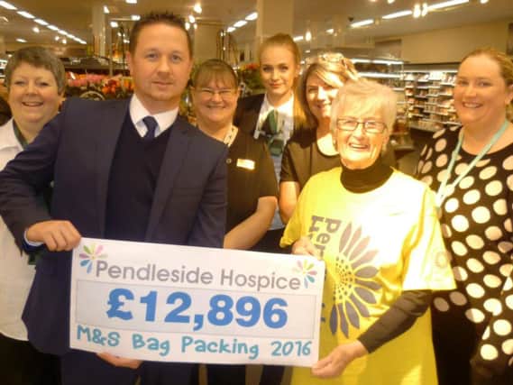 Marks and Spencer champion bag packers (from left to right) Donna Wilkinson, Andy Horridge, store manager, Angela Berry, Emily Moorcroft, Linzi Swayne,  hospice volunteer and bag packer Sheila Hawkes and hospice fund raising assistant Heather Conn.