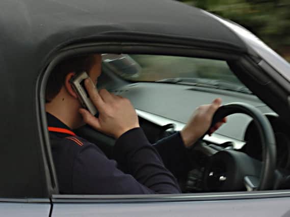Lancashire Police crackdown on mobile phone use behind the wheel