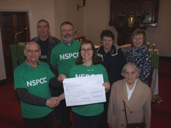 Parishioners with the cheque they generously donated to NSPCC.