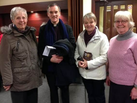 Bishop John with CAFOD volunteers at St John the Baptist RC Church, Burnley
