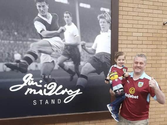 Ben and Henry Walsh outside their beloved Turf Moor