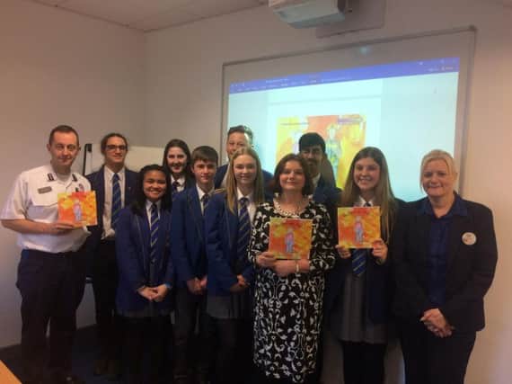 The young Hazardous Harry authors from Blessed Trinity RC College with MP Julie Cooper, Chris Waring, fire service delivery manager and Billie Jean Horne, the community Champion from Tesco. (s)