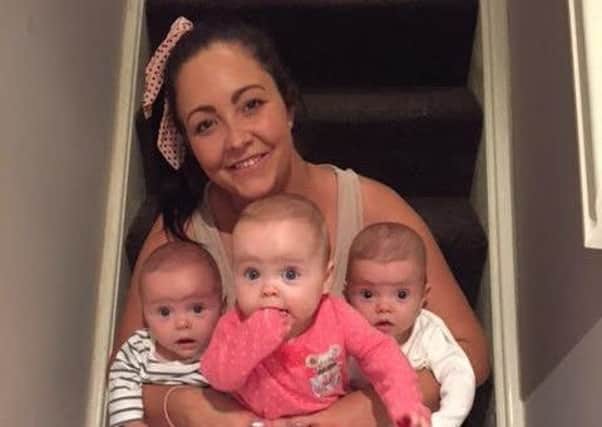 Laura Slinger (29) with triplets Elsie, Eilah and Erin